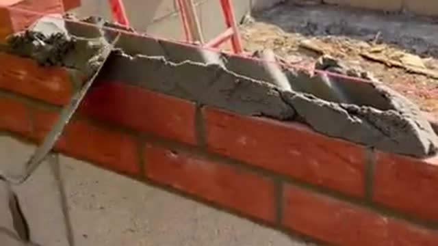 Laying bricks on a beautiful sunny day