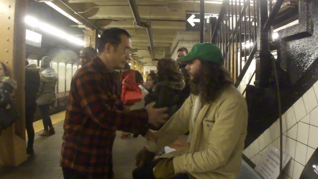 Luodong Massages White Guy With Long Hair In Subway Station