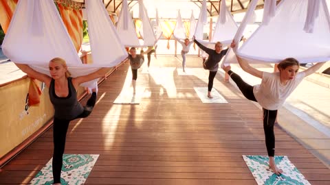 Group of women practicing yoga in the morning