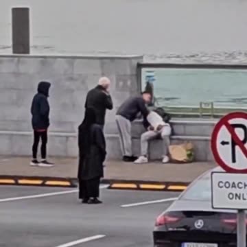 Look at these wasters! An Irish couple are forced to move off the footpath to