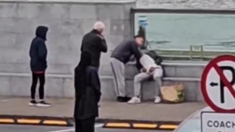 Look at these wasters! An Irish couple are forced to move off the footpath to