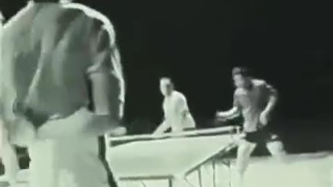 Bruce Lee beats two professional table tennis players, using only the nunchucks