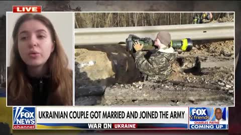 Ukrainian newlyweds vow to defend their country