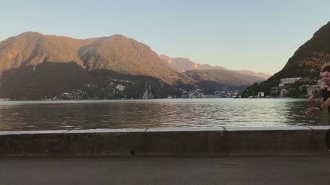 Pausing among people in front of the sea