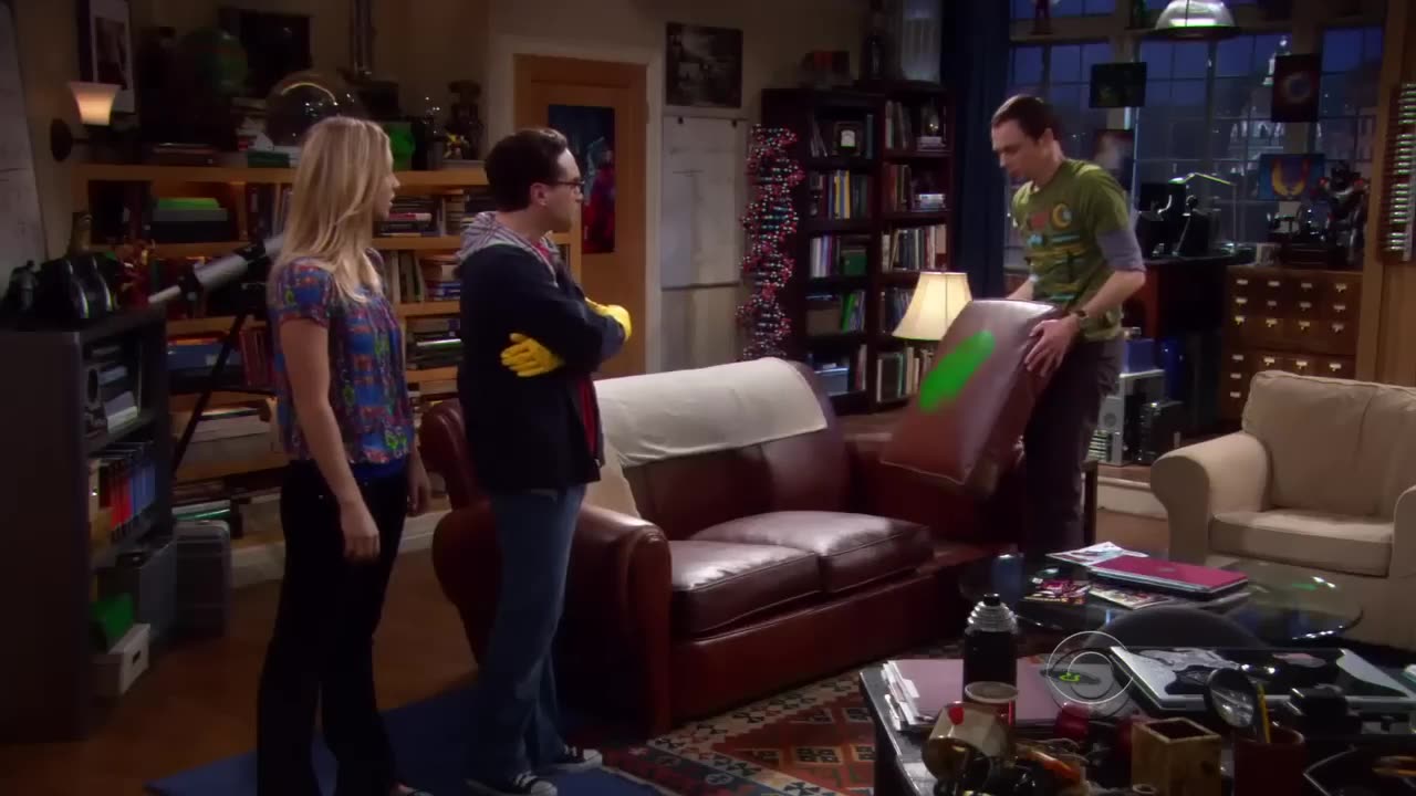 Penny accidentally shoots Sheldon's beloved sofa cushion with a paintball gun - The Big Bang Theory