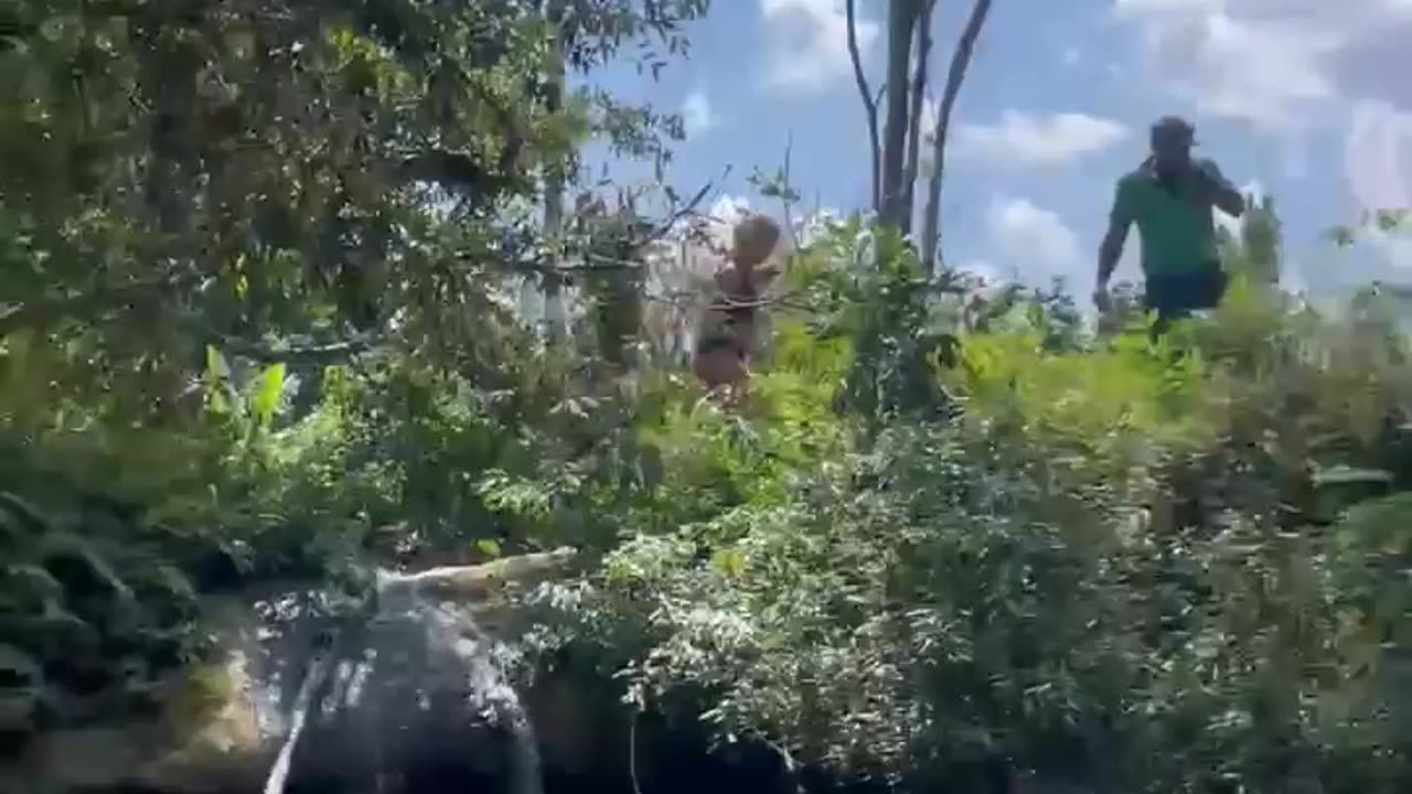 Diving into the crystal water in the Cuban river