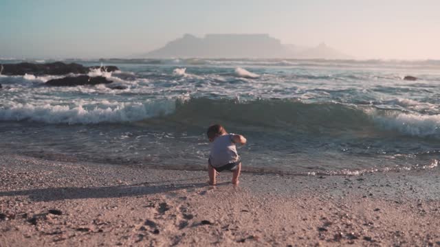 The kids are playing on the beach