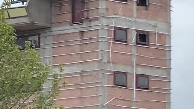 Lightning hit the crane on top of the skyscraper, the footage went around the world