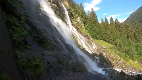 A Majestic Waterfalls From The Rocky Mountain