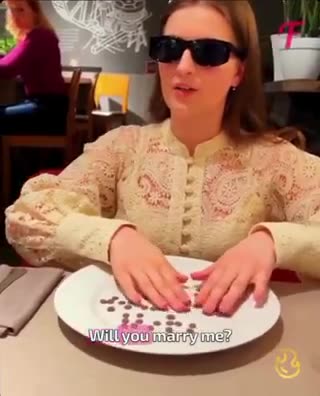 Man surprises his blind girlfriend with a braille proposal