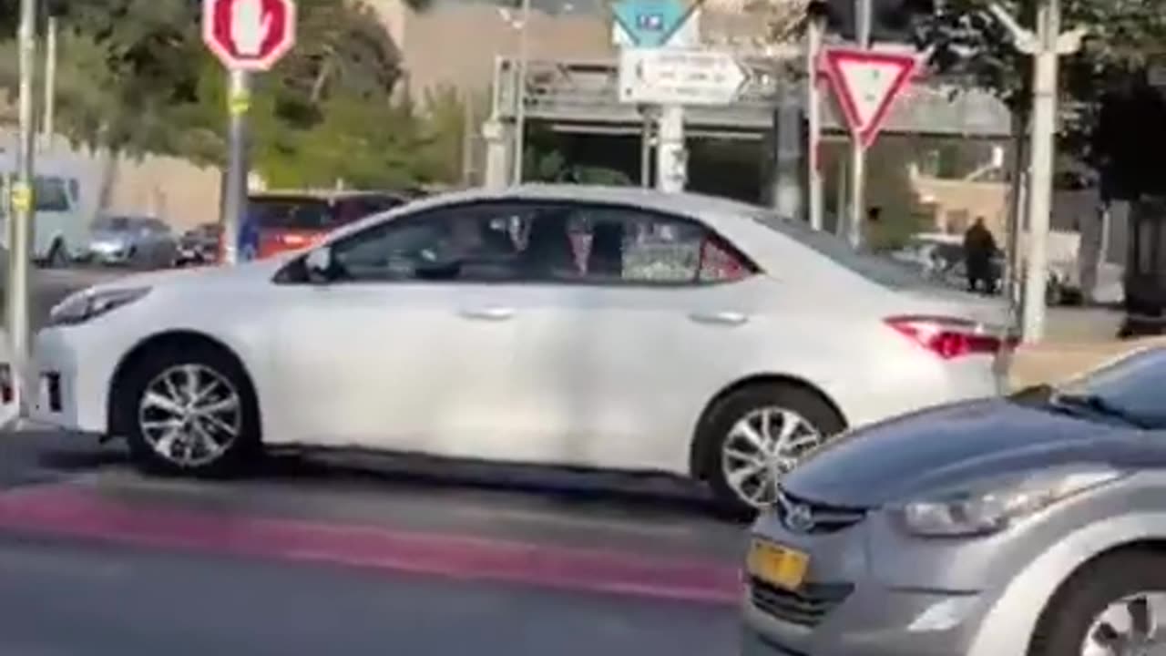 Two terrorists arrive this morning at a bus stop in the center of Jerusalem