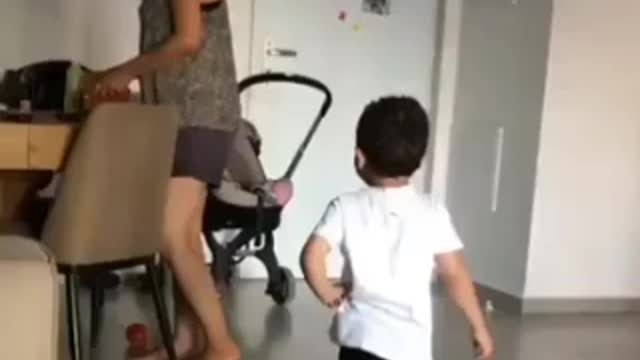 look at the kid face after passing the football between legs