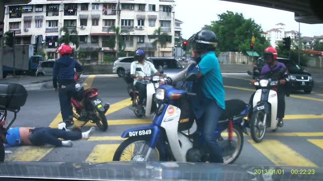 Car Flips Motorcyclist Off Bike at Intersection