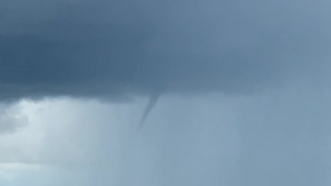 Funnel Forms Above Farmer's Crops