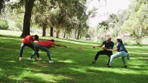 video colleagues playing tug of war