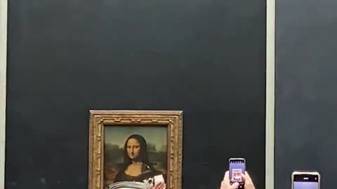Climate Radical Attacks Mona Lisa Painting at the Louvre in Paris