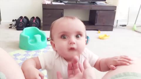 Funny Baby tries to not laugh at all