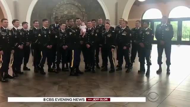 Army "brothers" of fallen step in for photoshoot with his newborn baby