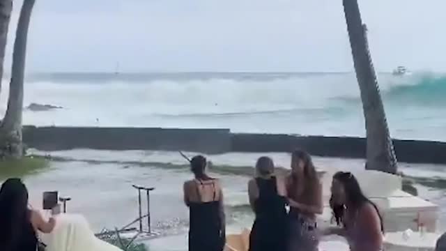 A big wave put that damper on a wedding reception in Hawaii