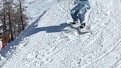 Handsome guy on snowboard