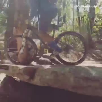 Guy blue long sleeve shirt rides bike on rocks lands head first into dirt falls off bike