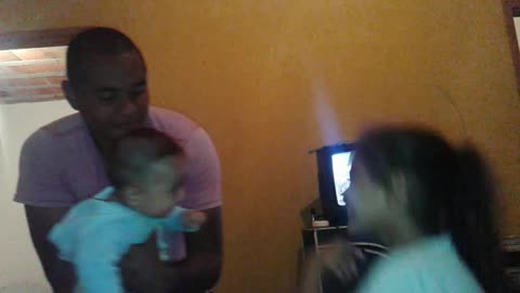 playing with dad and sister
