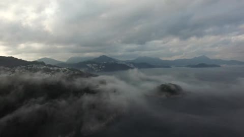 Flying Over Misty Coastline