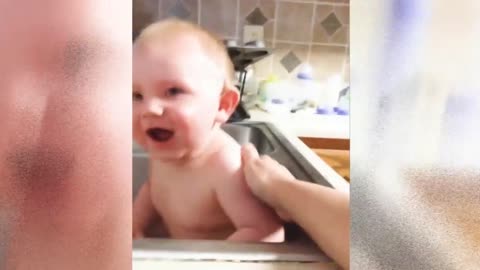 Cute baby playing with water