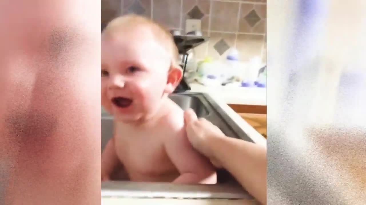 Cute baby playing with water