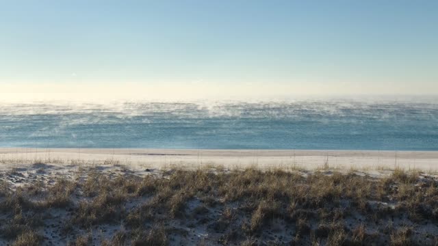 Amazing Sunrise over the Beach During an Icy Winter