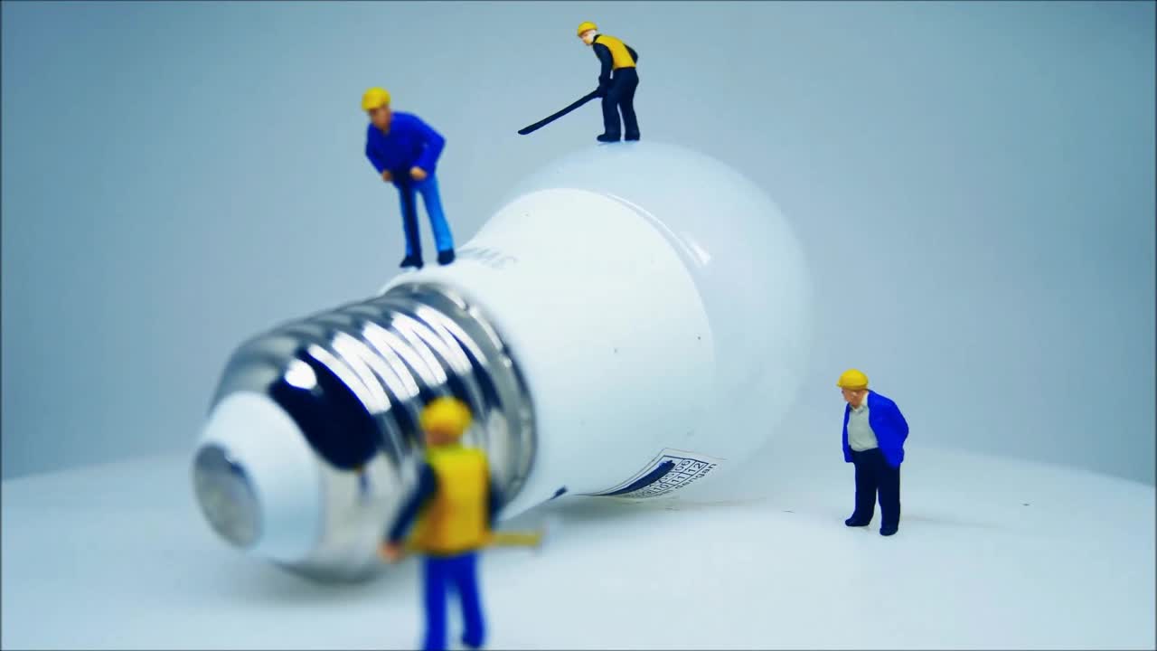 Close up Video of a liquid bulb and miniature Toy.