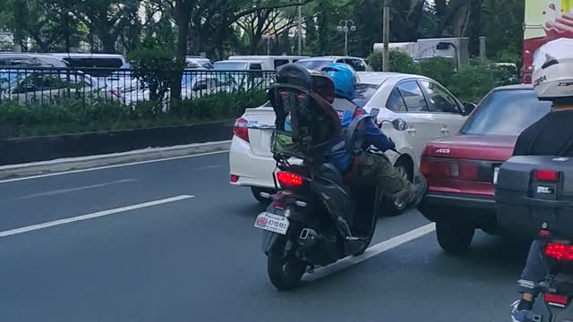 Motorcyclist Gives Car a Much-Needed Nudge