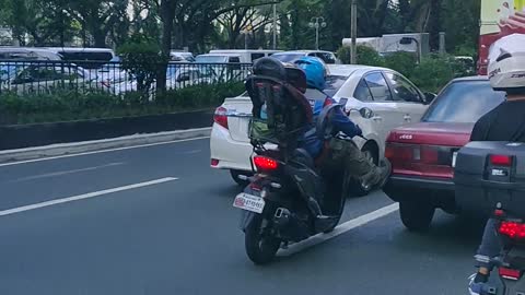 Motorcyclist Gives Car a Much-Needed Nudge