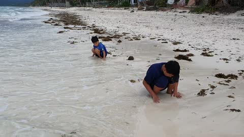 Playing with waves on the beach