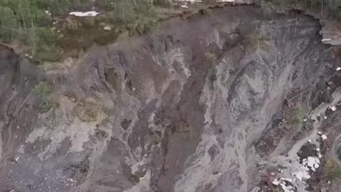 Powerful landslide sweeps homes into the sea