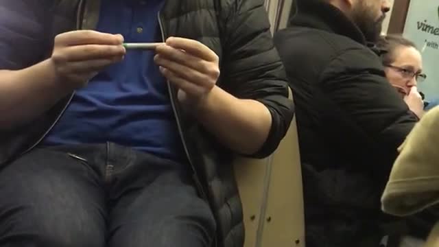 Guy does magic tricks on subway, makes coin disappear with a green sharpie