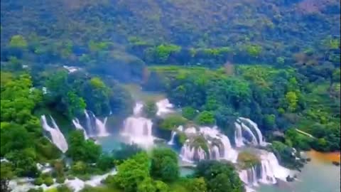 Primeval forest covered with waterfalls