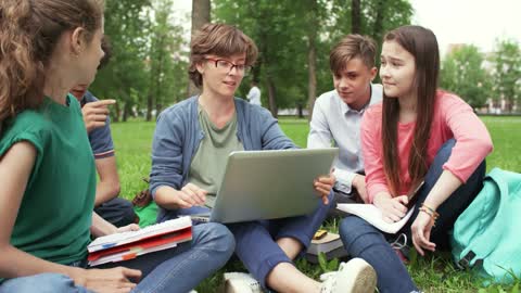 A Group Of Young People In Discussion Of A Group Project
