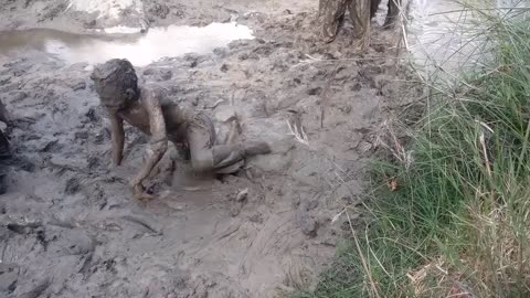 Children Playing Mud Games