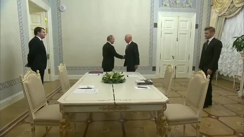 Schwab giving Putin his book on how to shape the fourth revolution. Is it significant?