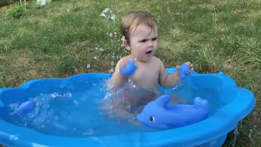 Cute_Baby_Playing_with_Water_in_Baby_Pool