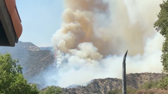 Smoke Engulfs Sky As Wildfire Spreads Rapidly With Onshore Winds in California