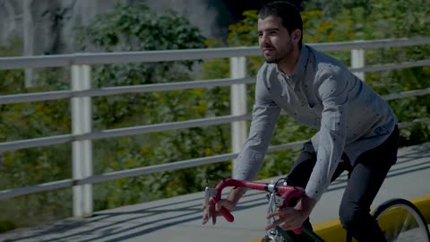 Cyclist riding down street