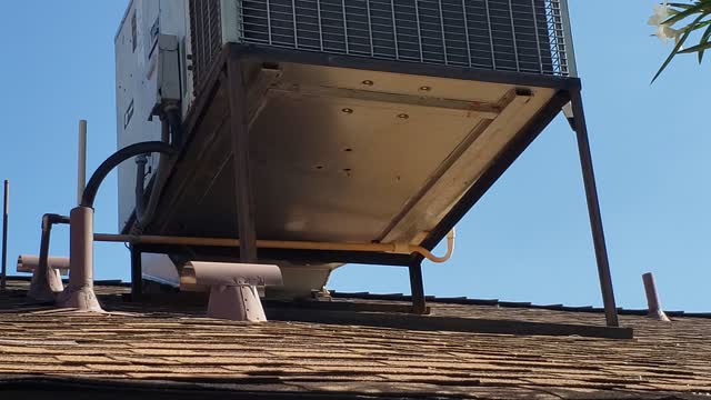 Roof mounted heat pump leaking into attic