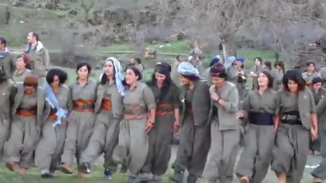 Kurdish female fighters dancing in the mountains of Kurdistan_Cut