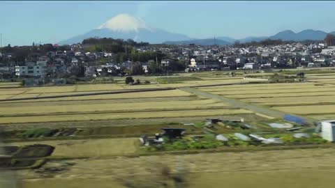 Bullet Train Crushing Through Mount Fuji at