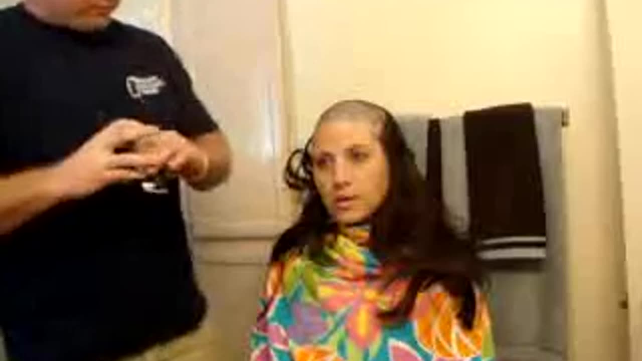 Father shave her daughter hair at home