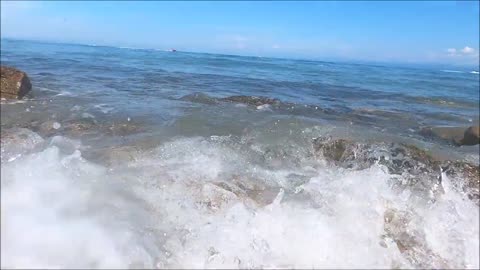 Waves Breaking Over The Rocky Shore