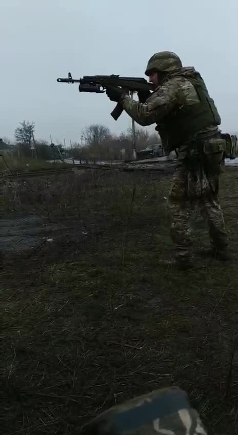 Ukrainian Soldier Firing Grenade at Russians