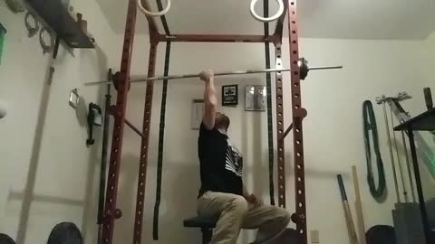 Reverse grip seated one arm barbell shoulder press